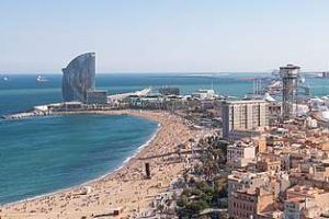 Aerial_view_of_Barceloneta_Beach_and_Port_Vell_in_Barcelona,_Spain